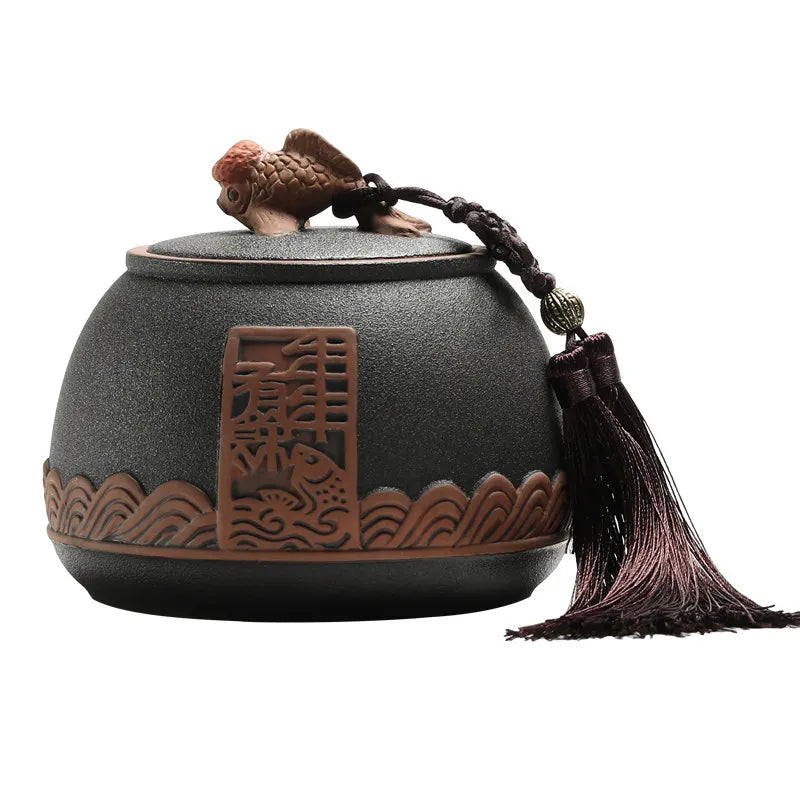 pot thé rouge jaune noir artisanal motifs floraux poisson chaîne pompon hermétique