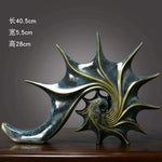 sculpture coquillage vert doré résine spirale moderne art déco brillant