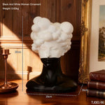statue tête noire blanche texture mat moderne abstraite bougie concombre loupe livres lampe
