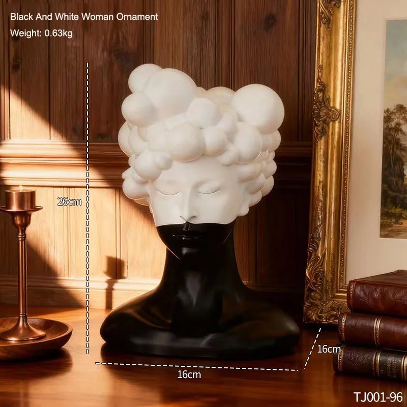statue tête noire blanche texture mat moderne abstraite bougie concombre loupe livres lampe