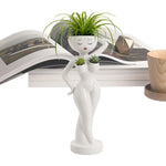 pots fleurs statuette blanche visage stylisé moderne minimaliste intérieur salon