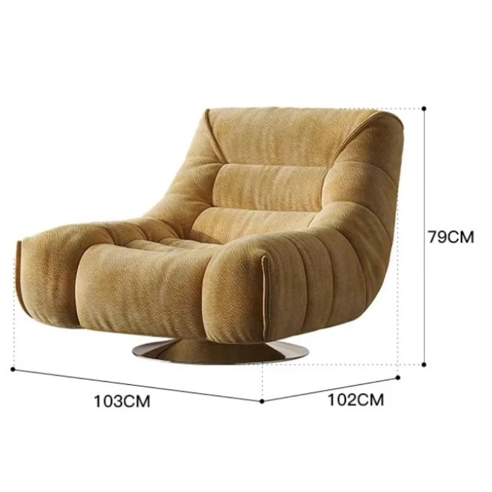 fauteuil pivotant moderne rose velours côtelé intérieur coussin décoratif livres vase fleurs