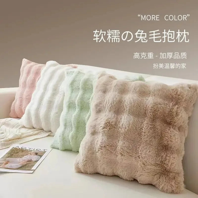 coussins rectangulaires peluche douce rose clair vert pastel lit tissé rayures horizontales moderne respectueux