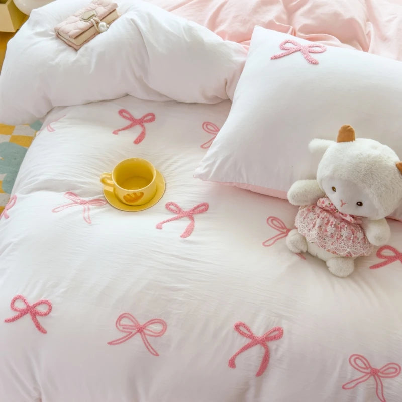 Ensemble de draps 3 pièces rose sur lit