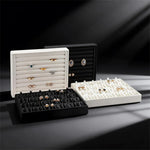 boîte bijoux cuir noir blanc plateau rangement bague boucle d'oreille organisation modernescrição