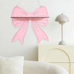 étagère murale bois rose clair motif ruban moderne clips métalliques