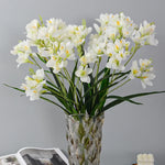 décoration intérieure bouquet artificielle orchidée blanc bleu rose feuilles verte moderne minimaliste