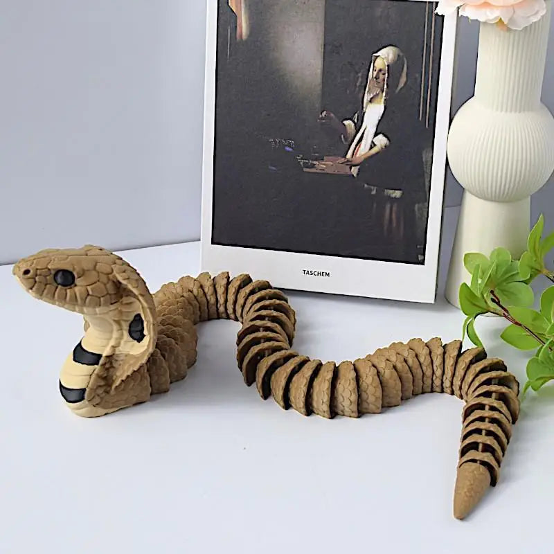 jouet serpent articulé marron noir réelle 33cm décoratif imitations écailles texturées éléments fleurs livres