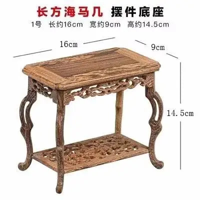 table basse bois rose classique gravures artisanal marron clair pot plante figurine cadre photo