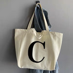 sac main femme toile beige clair lettre noire poignées détachables