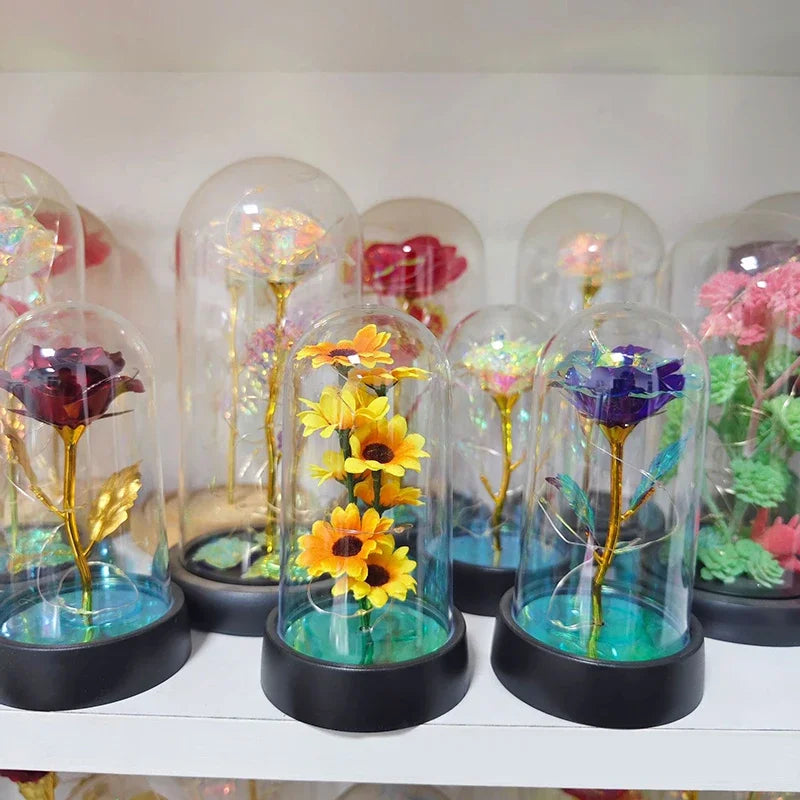 décoration florale cloche verre fleurs jaunes tige verte base noire guirlande led lumineuse romantique