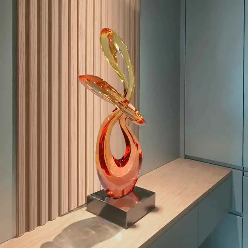 décoration abstraite moderne résine transparente sculpture verre orange jaune socle noir