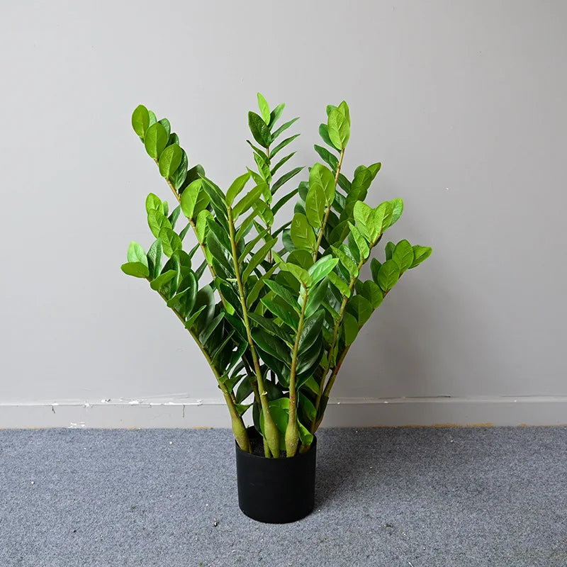 plantes artificielles branches vertes feuilles simples extérieur moderne pot blanc exposé