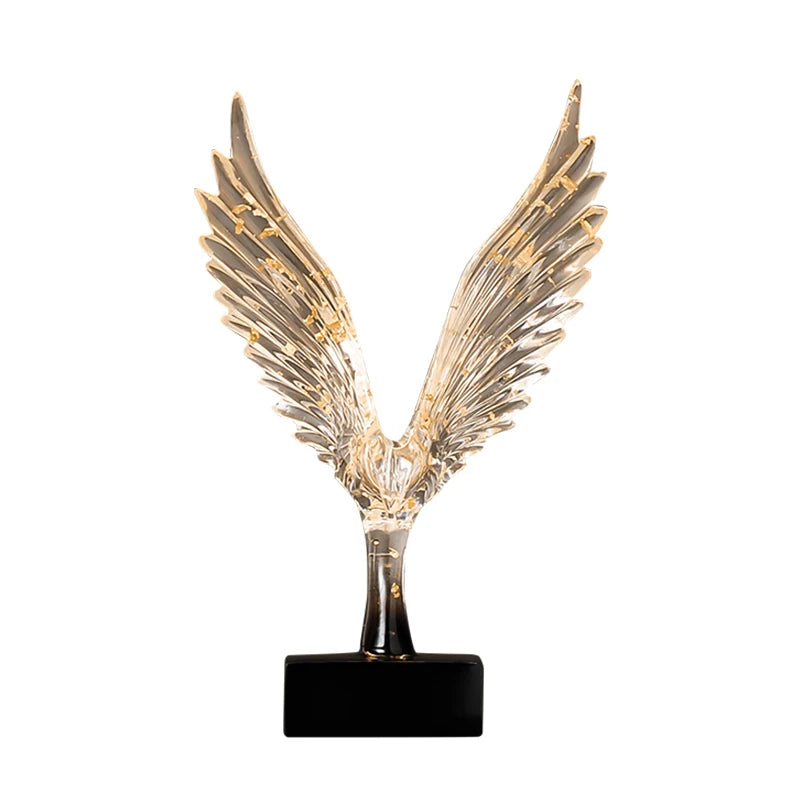 statuette animale moderne transparente dorée oiseau cerfs ailes déployées base noire