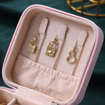 boîte bijoux simili cuir vert pastel moderne fermeture glissière blanc rose pâle boucles doreilles