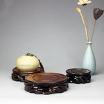 support décoratif bois sculpté motif floral artisanal marron foncé figurines bonsaïs vases plateaux
