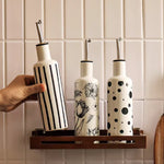 bouteilles cuisine céramique blanc noir rayures fleurs moderne assaisonnement huile épices stockage respectueux environnement