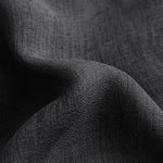 Drapé élégant de tissu noir texturé idéal pour vêtements et décoration. Design intemporel, parfait pour ajouter une touche sophistiquée à votre intérieur ou garde-robe.