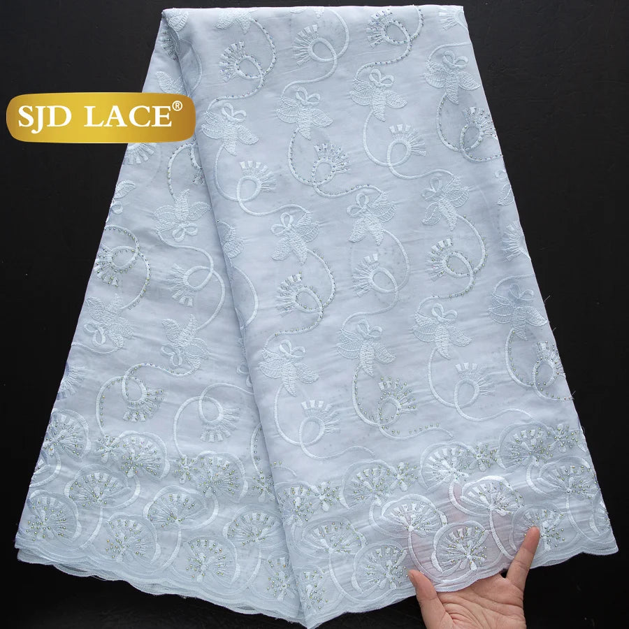 dentelle africaine coton broderie fleurs dorées franges opaques variétés couleurs bleu marine vert rouge