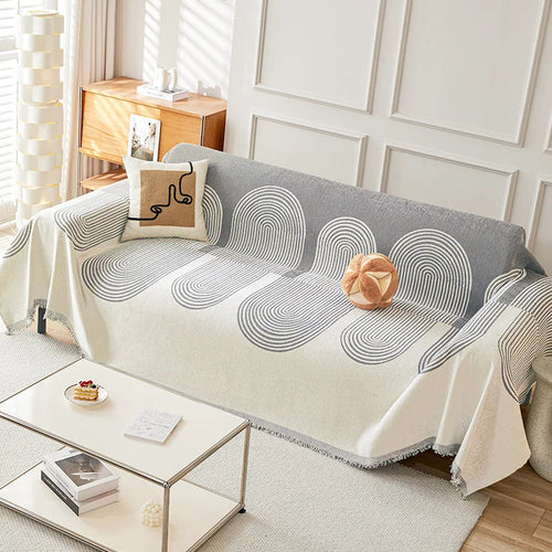 couverture canapé chenille jacquard motif spirales franges décoration salon moderne confortable beige