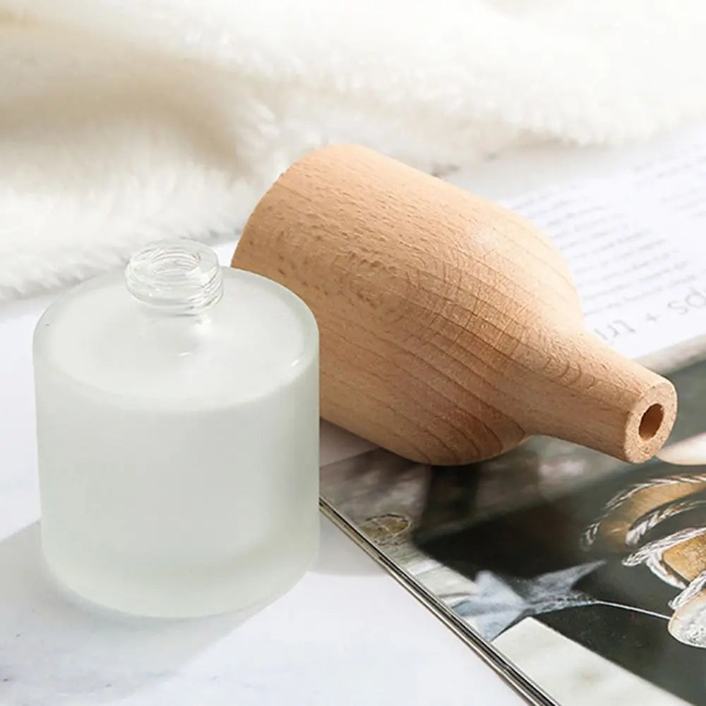 bouteille aromathérapie bois naturel blanc translucide huile essentielle verre dépoli minimaliste diffusion parfum