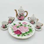 service thé miniature blanc bleu fleurs classique théière crème sucrier tasses assiettes
