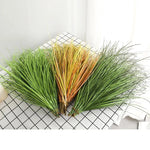 décoration extérieure plante artificielle vert clair moderne feuilles fines pointues exposition jardinextérieur