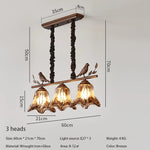 suspension lumineuse marron doré noir verre teinté métal sculpté moderne rustique chaînes noires