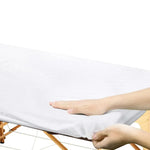 draps housses jetables blancs texture moderne table massage coussin cou