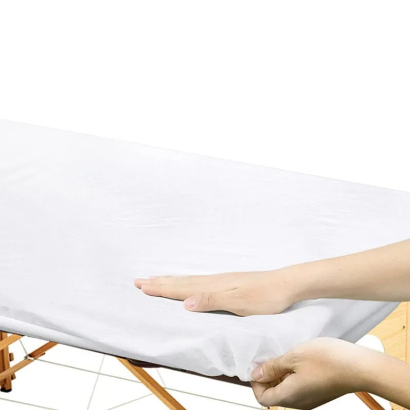 draps housses jetables blancs texture moderne table massage coussin cou