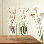 vase verre transparent moderne bouteille diffuseur parfum aromathérapie décoration salon minimaliste