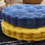 Coussin rond dans différentes couleurs disponibles chez Ombre Intérieur