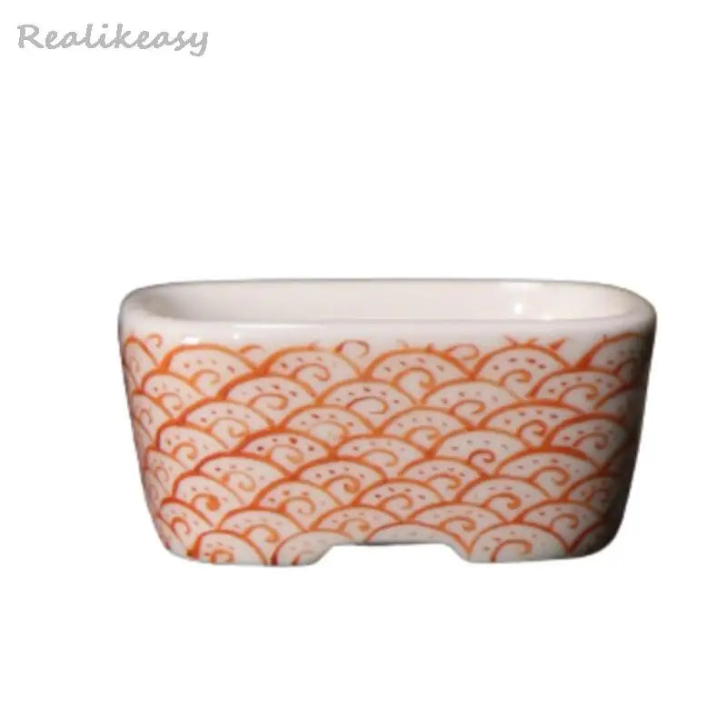 bol traditionnel décoré fruits pommes paysage motifs ondulés blanc orange bleu
