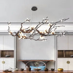 suspension luminaire branches cuivre fleurs artificielles moderne noir blanc salon salle manger intérieur