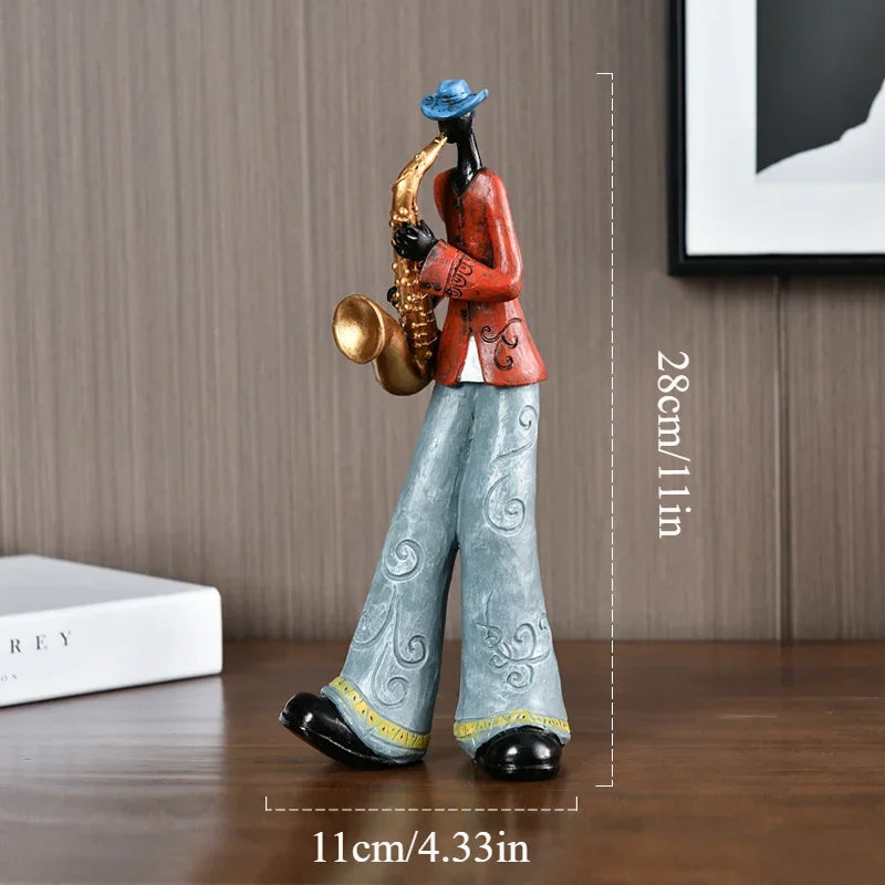 statues musiciens résine trompette saxophone chanteur clavier violoncelle ethnique artisanal décoration maison salon