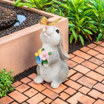statue lapin bouquet fleurs extérieure éclairage solaire papillon jardin champêtre animal décoration festive