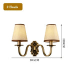 chandelier bronze classique suspension lumière abat jours tissu texturé courbes salle manger