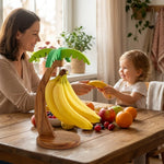 support fruits bois clair feuilles vert bananes citrons raisins pommes oranges tasse vertical comptoir