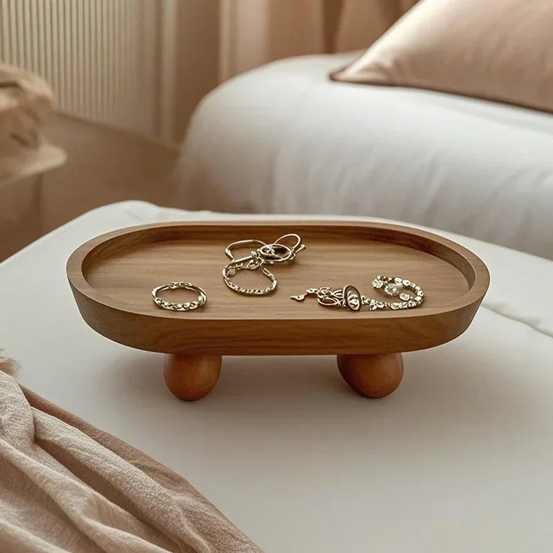 plateau ovale bois naturel minimaliste pieds boules anneaux bracelets tasses fruits bougies assiettes