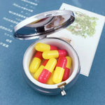 boîte pilules argentée moderne boîte médicaments compacte boutons pression contenant pilules