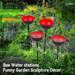 station d'eau abeilles moderne rouge jaune noire ronde brillante crochet métallique jardin deco