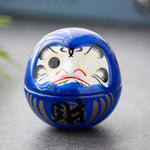 décoration table céramique daruma dolls visage stylisé motifs floraux traditionnel japonais couleur rose bleu