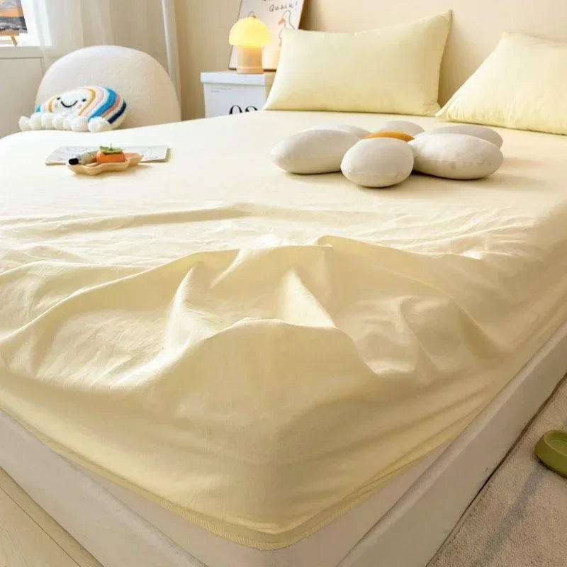 protège matelas carreaux bleu clair gris clair rose clair jaune clair vert clair classique