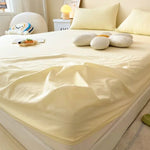 protège matelas carreaux bleu clair gris clair rose clair jaune clair vert clair classique