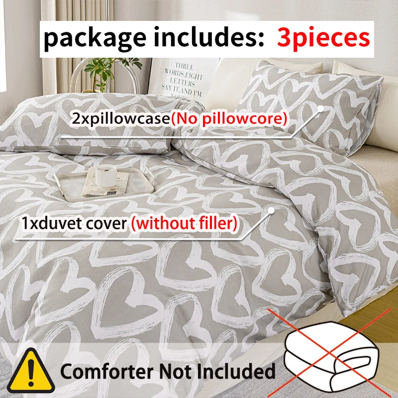 ensemble literie housse couette deux taies d'oreiller coeur gris blanc moderne