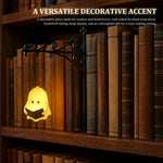 lampe décorative vintage suspendue personnage livre bras végétaux noir jaune blanc