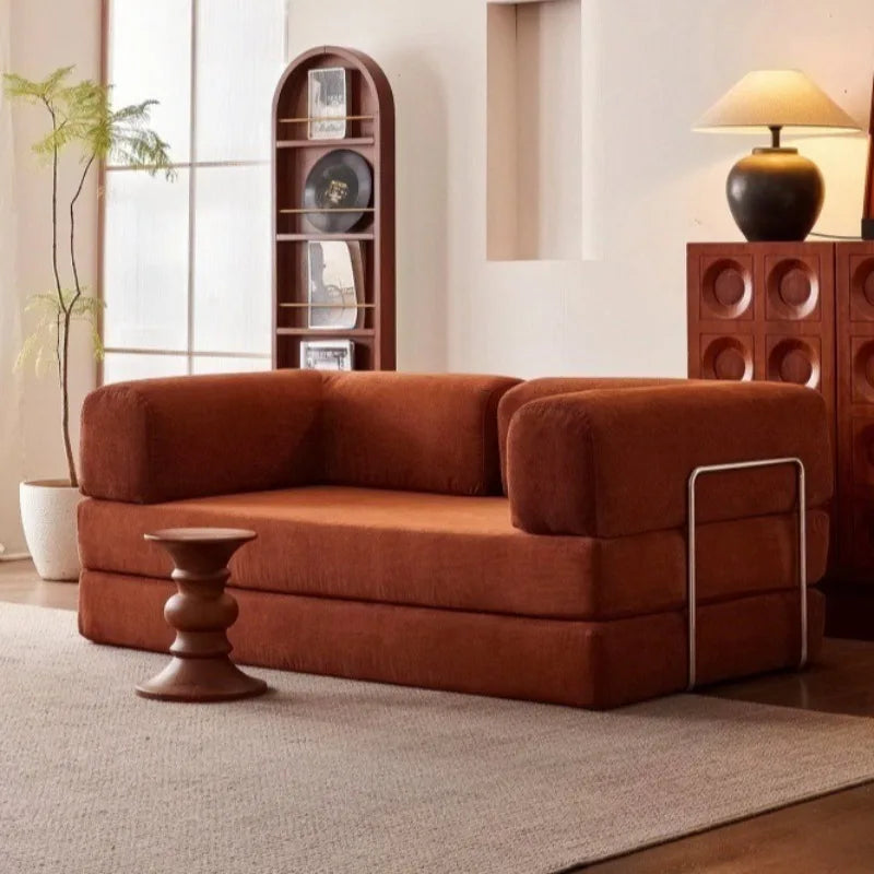 canapé sectionnel moderne velours marron coussins minimaliste métal opaque salon