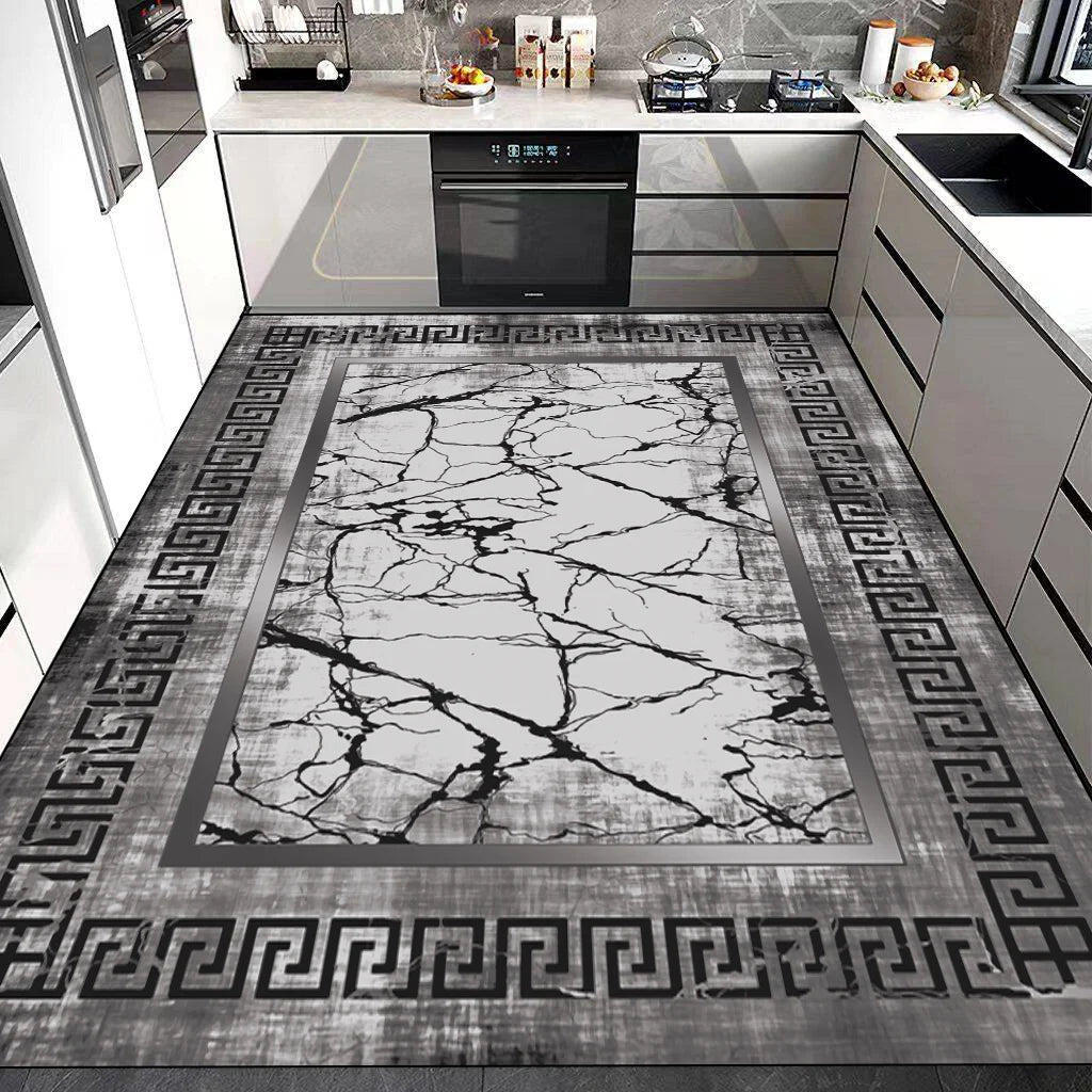 Sol en marbre noir et blanc avec bordure grecque dans une cuisine moderne.