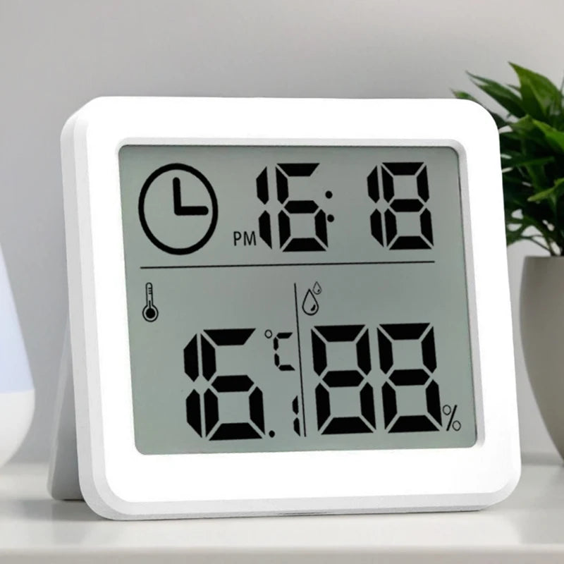 horloge numérique hygromètre blanc moderne affichage heure température humidité symbolique thermomètre minimaliste