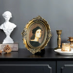 cadre photo ovale vintage portraits anciens relief floral verre transparent or vieilli posé accroché
